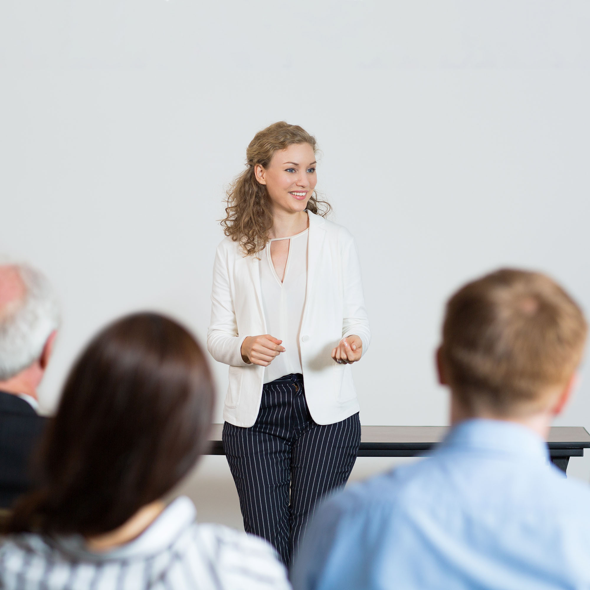 Successful Young Businesswoman Holding Speech